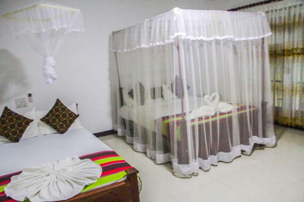 Postel nebo postele na pokoji v ubytování Sigiriya Mana B&B
