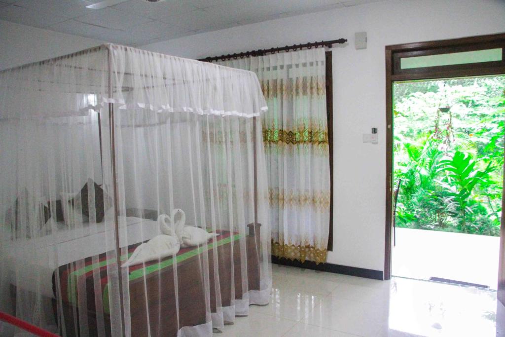 Postel nebo postele na pokoji v ubytování Sigiriya Mana B&B