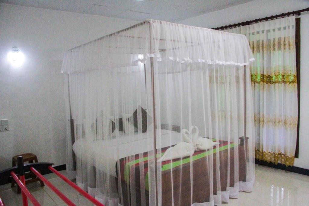 Postel nebo postele na pokoji v ubytování Sigiriya Mana B&B