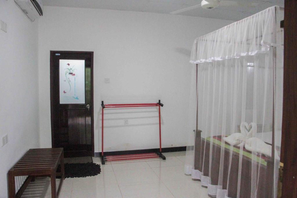 Postel nebo postele na pokoji v ubytování Sigiriya Mana B&B
