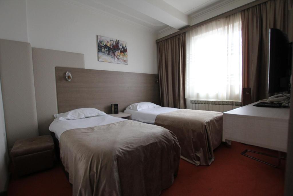 Postel nebo postele na pokoji v ubytování Hotel S