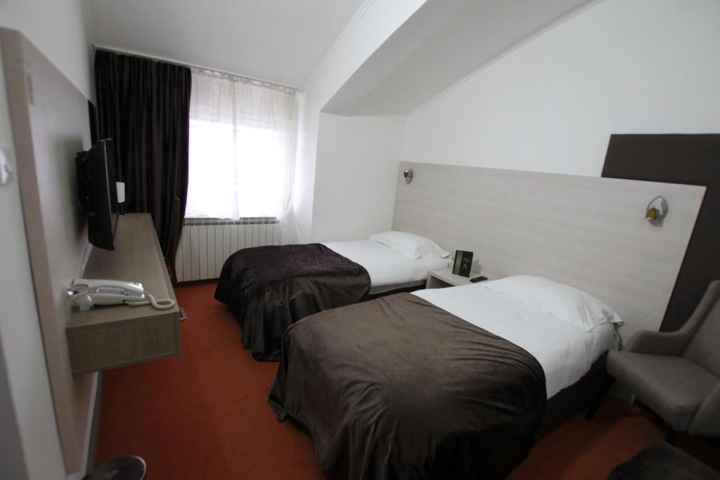 Postel nebo postele na pokoji v ubytování Hotel S