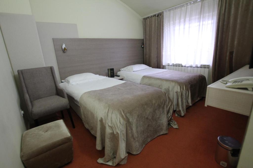 Postel nebo postele na pokoji v ubytování Hotel S