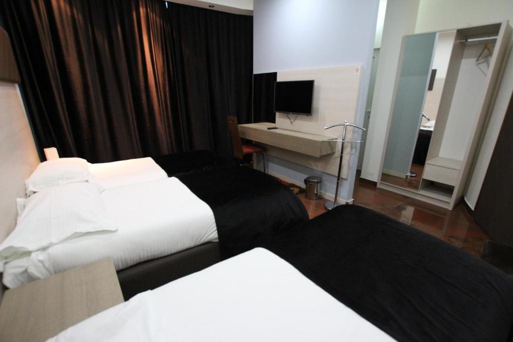 Postel nebo postele na pokoji v ubytování Hotel S