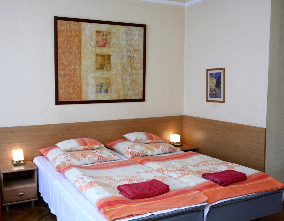 Posteľ alebo postele v izbe v ubytovaní City Centre Cosy Apartments