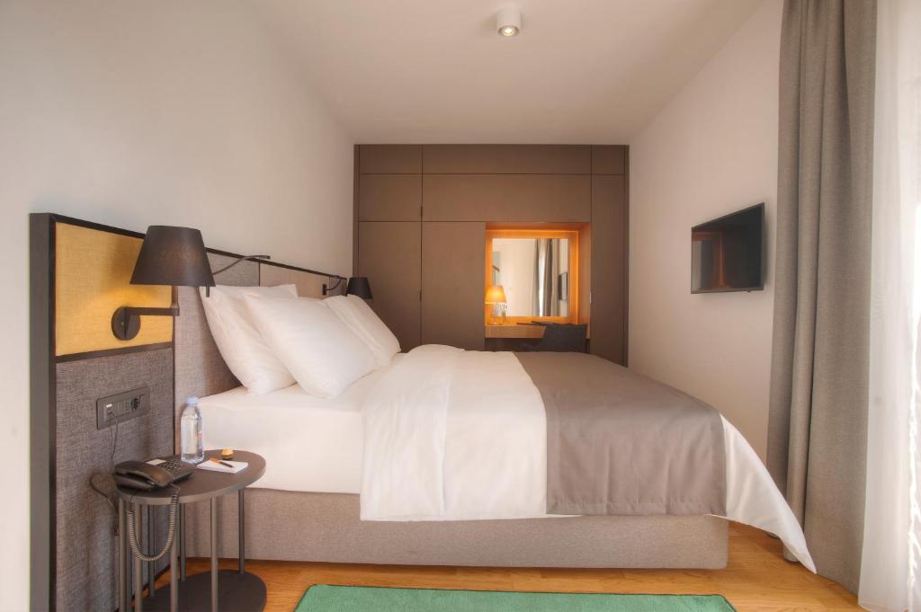 Krevet ili kreveti u jedinici u okviru objekta Fontana Hotel & Gastronomy