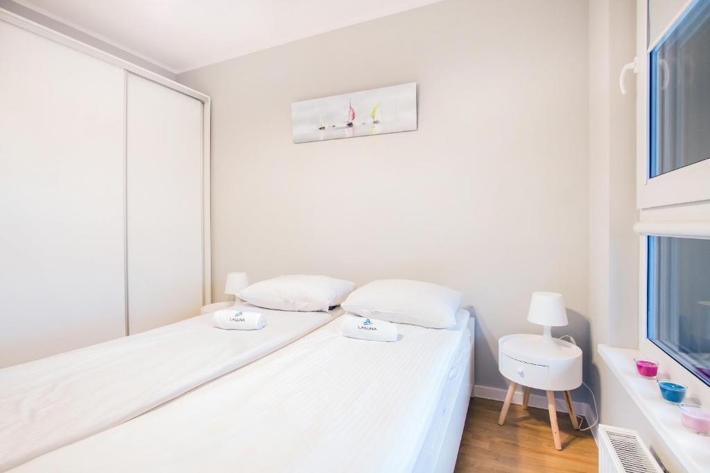 Posteľ alebo postele v izbe v ubytovaní Apartments Gdynia Na Fali with Free Parking by Noclegi Renters