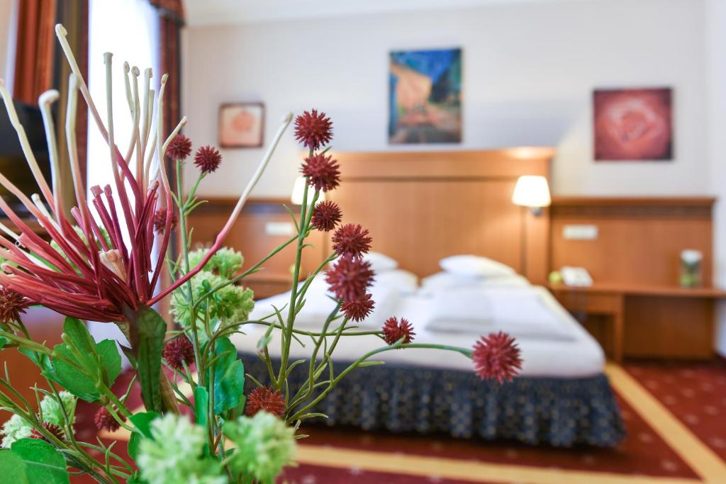 Postel nebo postele na pokoji v ubytování Hotel Alexandra