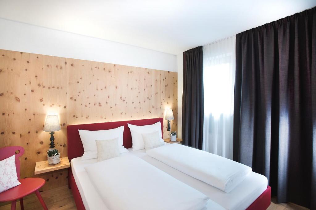 Postel nebo postele na pokoji v ubytování Hapimag Ferienwohnungen Zell am See
