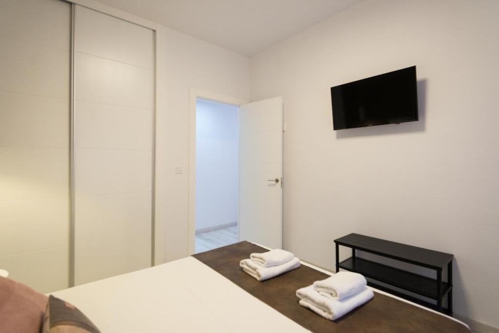 Televízia a/alebo spoločenská miestnosť v ubytovaní Nuevo centro 3 hab 2 baños ac wifi