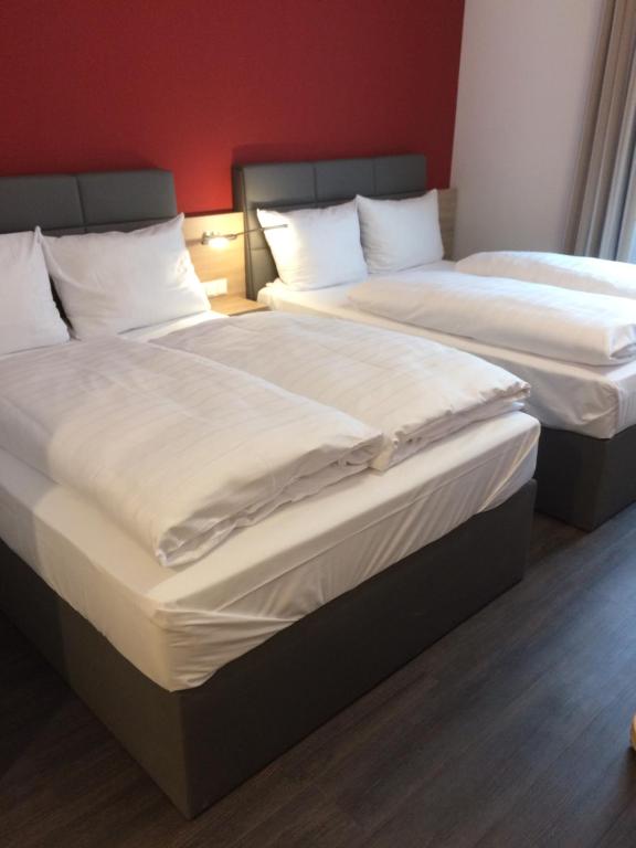 Postel nebo postele na pokoji v ubytování Adesso Hotel Göttingen - pay at property on arrival-Ihr Automatenhotel in Göttingen