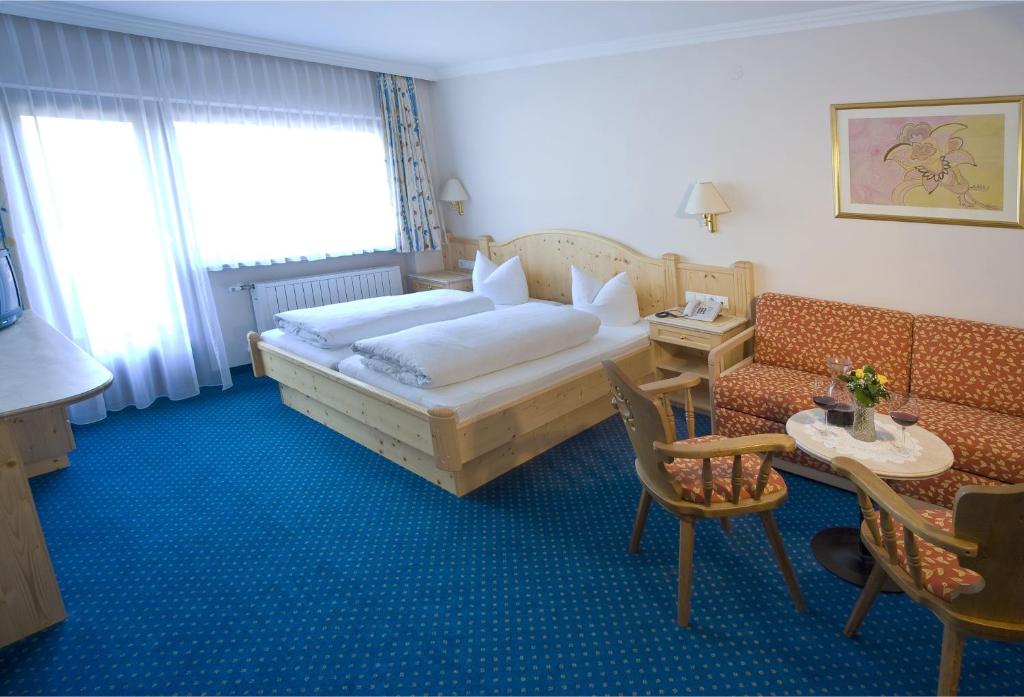 Postel nebo postele na pokoji v ubytování Hotel Brunella