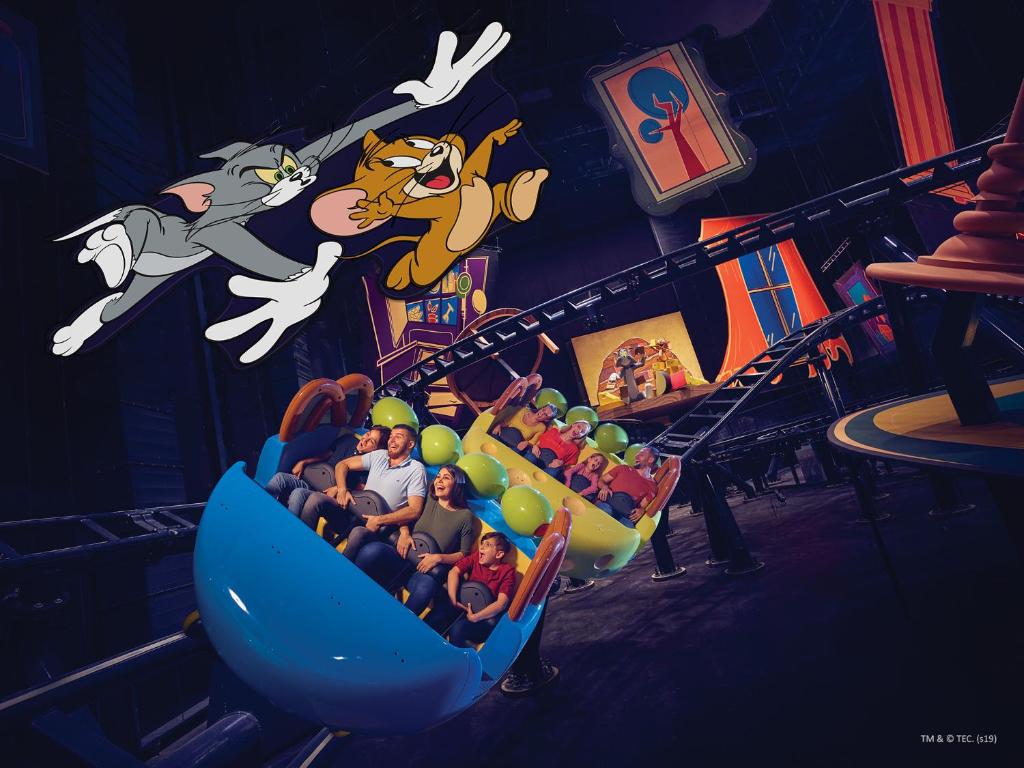a group of people riding on a roller coaster at Yas Island Rotana Abu Dhabi in Abu Dhabi