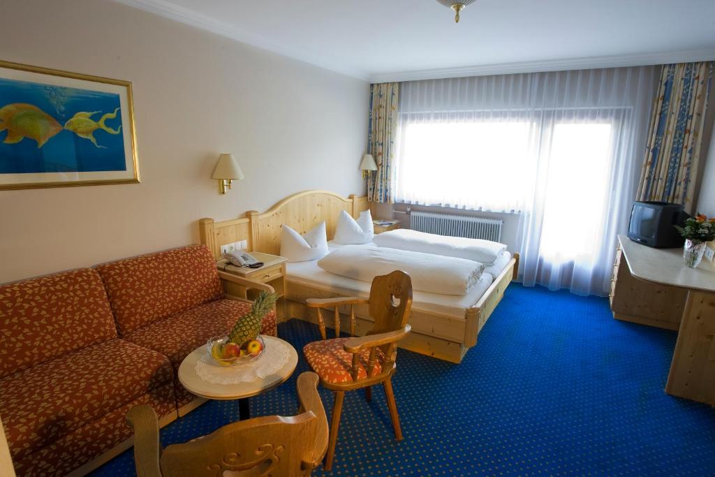 Postel nebo postele na pokoji v ubytování Hotel Brunella