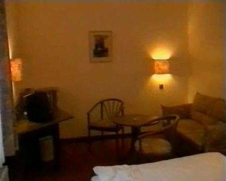 Postel nebo postele na pokoji v ubytování Hotel Merkur Garni