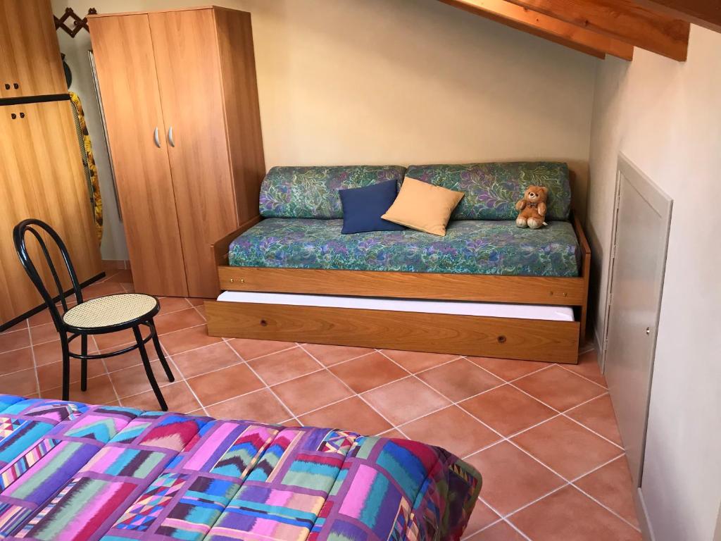 A bed or beds in a room at Mansarda Margherita