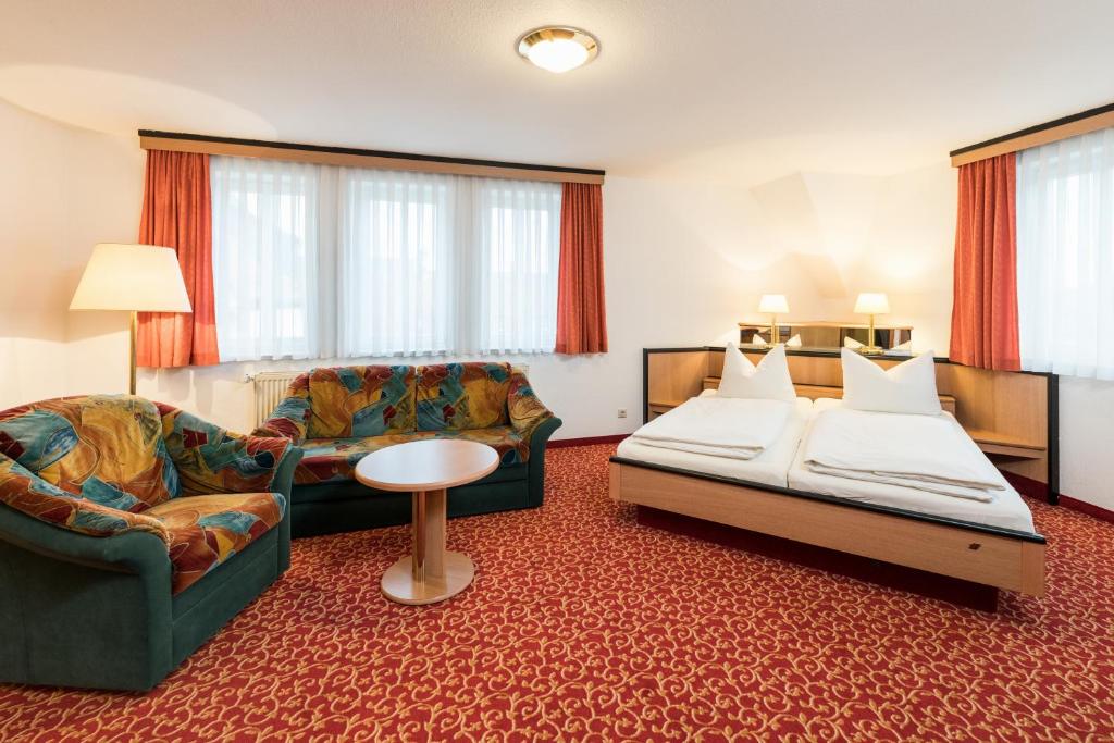 Postel nebo postele na pokoji v ubytování Hotel am Markt