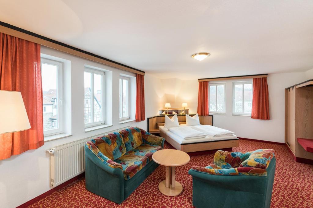Postel nebo postele na pokoji v ubytování Hotel am Markt