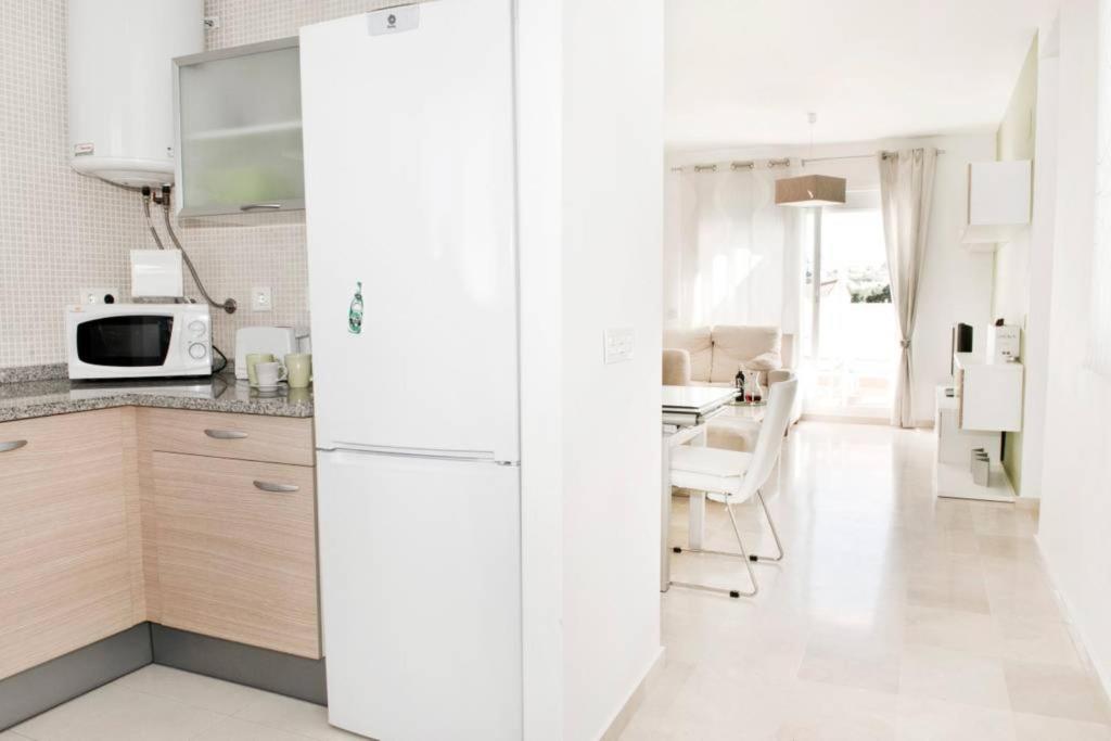 A kitchen or kitchenette at Rincon Penthouse Beach Pool Terrace 2Bed