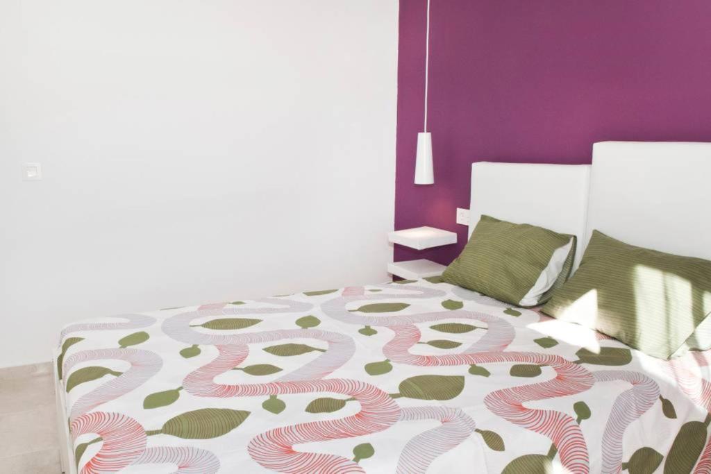 A bed or beds in a room at Rincon Penthouse Beach Pool Terrace 2Bed