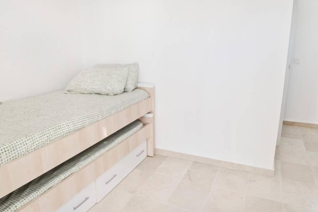 A bed or beds in a room at Rincon Penthouse Beach Pool Terrace 2Bed