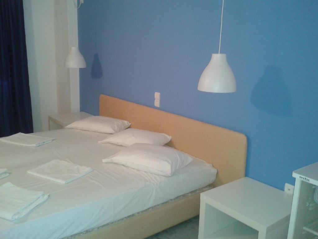 Postel nebo postele na pokoji v ubytování Hotel Blue Fountain
