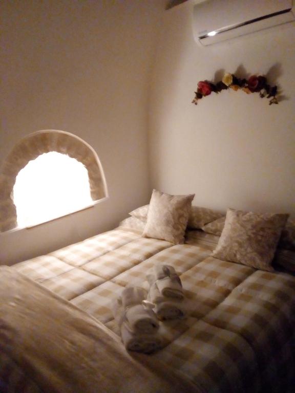 A bed or beds in a room at Trulletto dei sogni