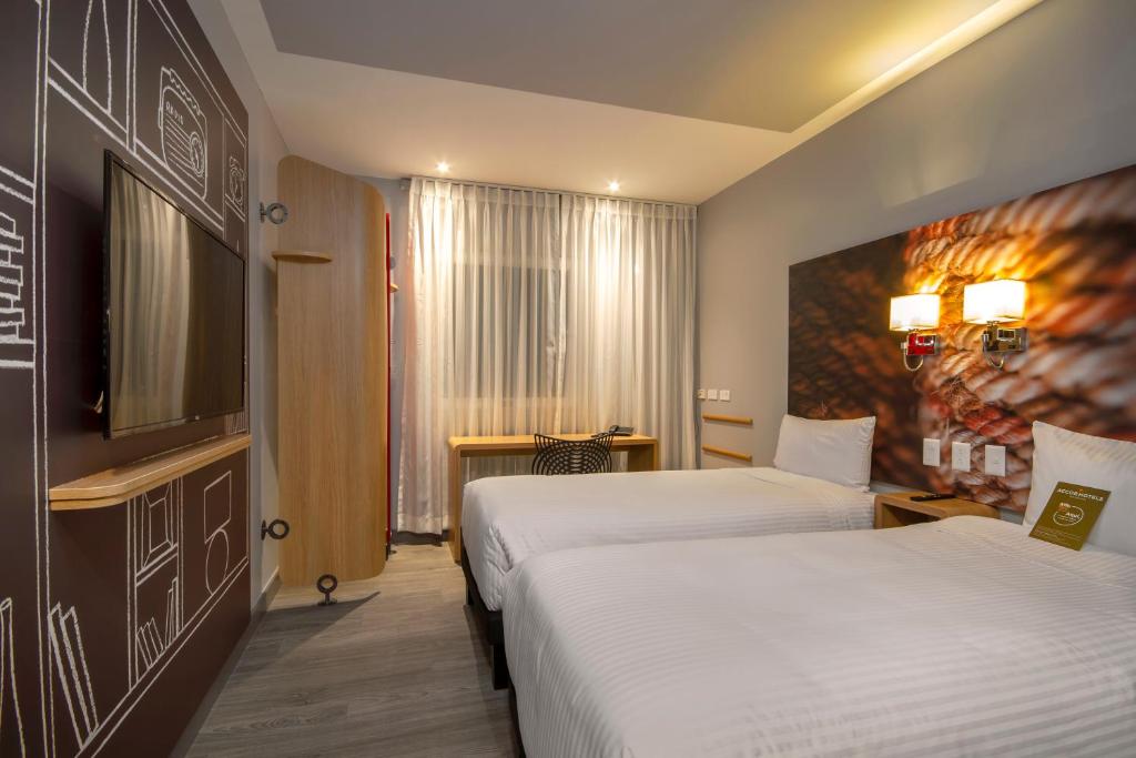 Ліжко або ліжка в номері ibis Quito