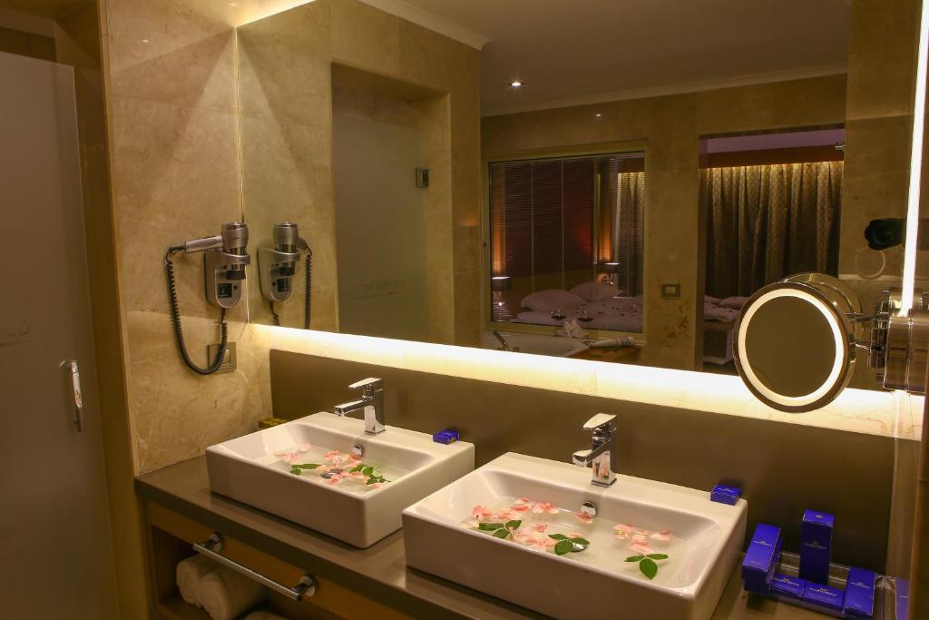 A bathroom at Ramada Resort by Wyndham Unye