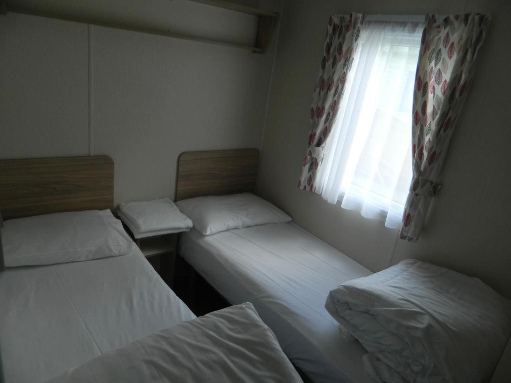 Postel nebo postele na pokoji v ubytování Parkgate Farm