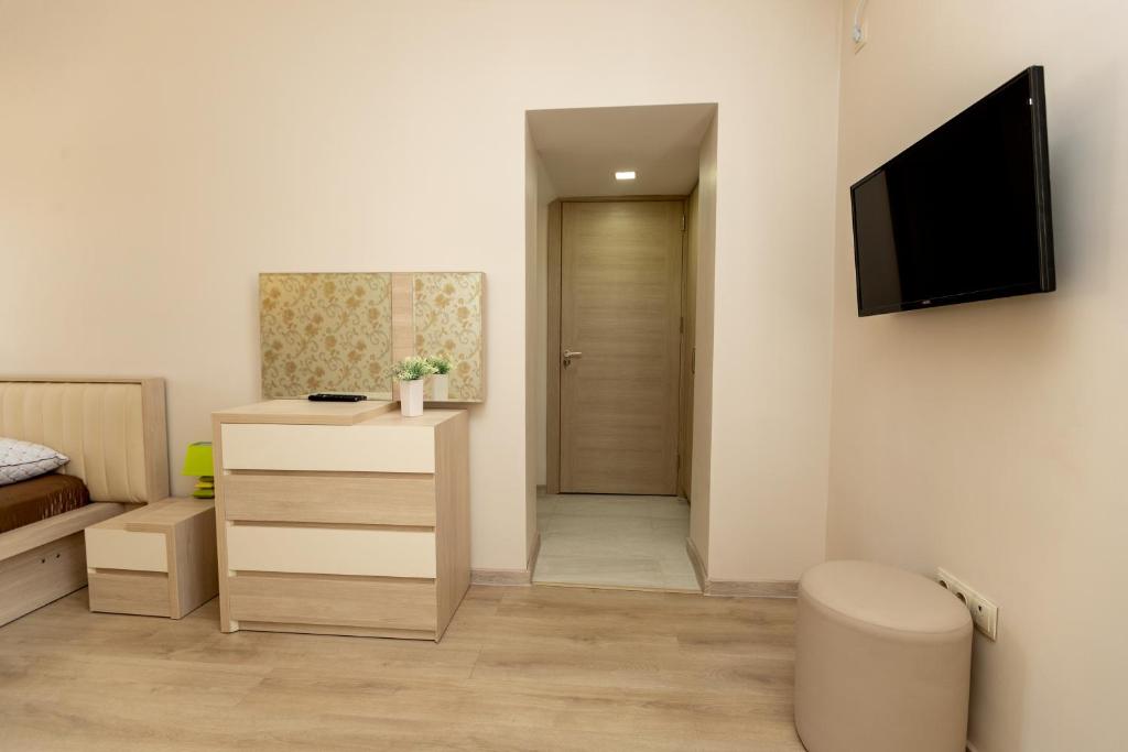 TV a/nebo společenská místnost v ubytování City Center Apartment