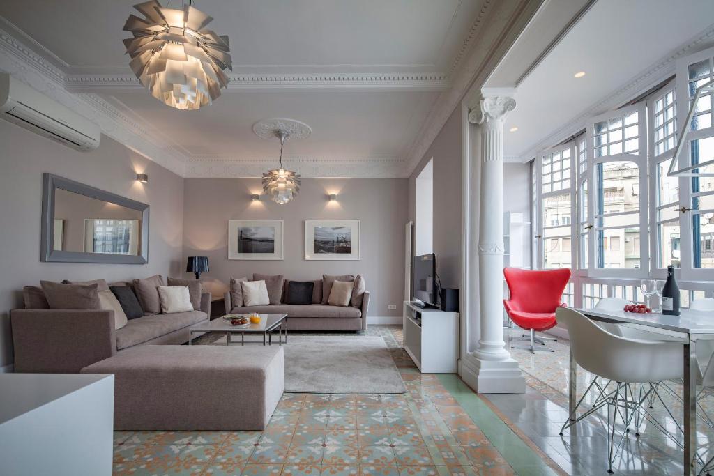 a living room with a couch and a table at Habitat Apartments Barcelona Classic in Barcelona