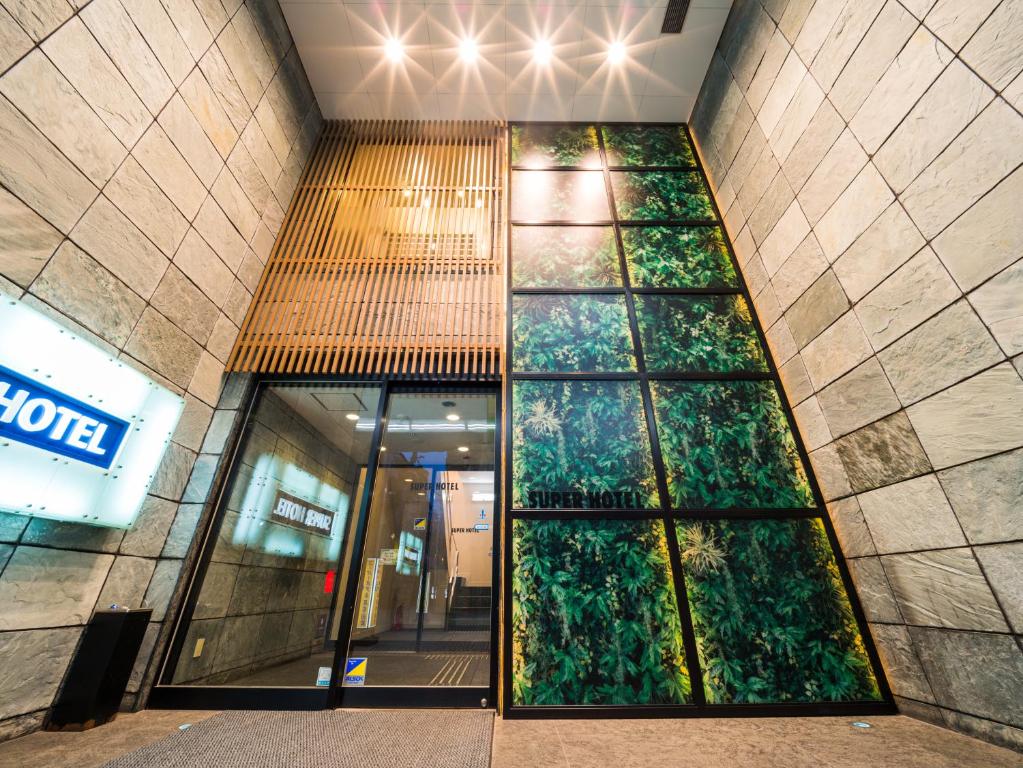 an entrance to a shopping mall with a building at Super Hotel Takamatsu Tamachi in Takamatsu
