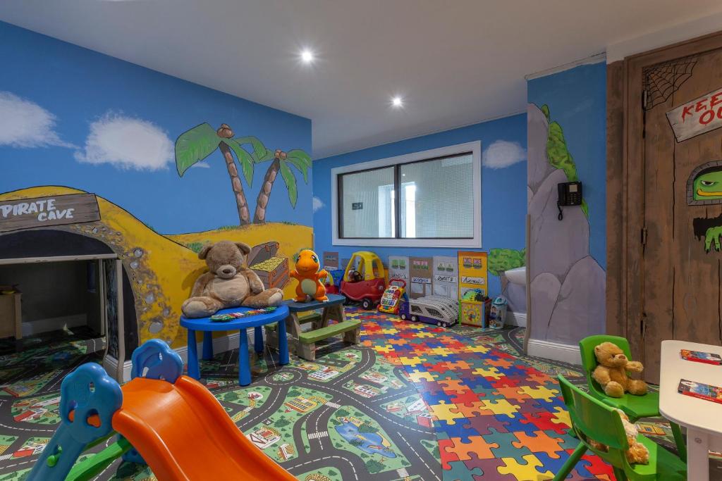 a childs play room with a stuffed animal on a table at Glenroyal Hotel in Maynooth