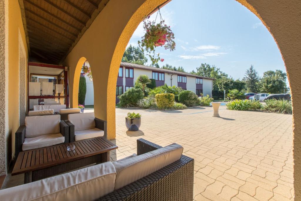 Posezení v ubytování Logis Hôtel Restaurant Solenca