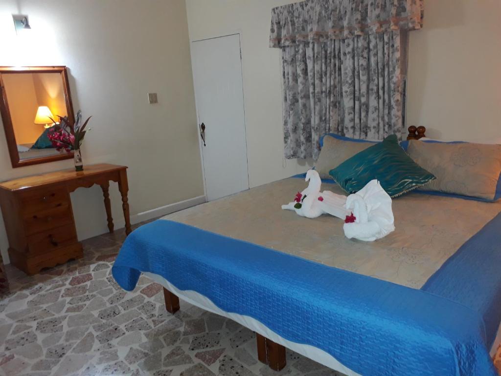 Postel nebo postele na pokoji v ubytování Paradise Inn