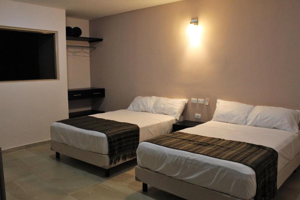 Postel nebo postele na pokoji v ubytování Hotel Virreyes