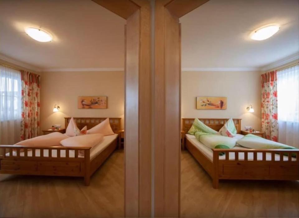 A bed or beds in a room at Appartements Zillertal Noten
