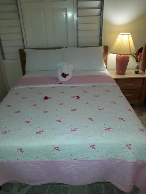 Postel nebo postele na pokoji v ubytování Paradise Inn