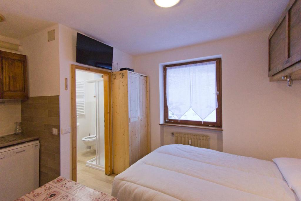 Postel nebo postele na pokoji v ubytování CasaMau Studio