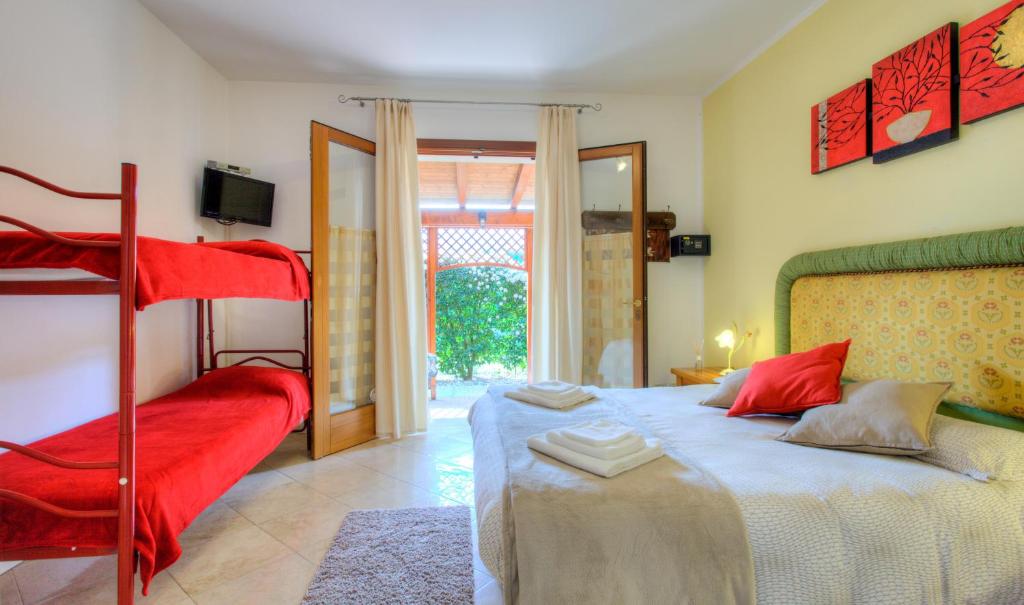 a bedroom with a bed and a bunk bed at B&B A Casa di Marta in Cavallino-Treporti