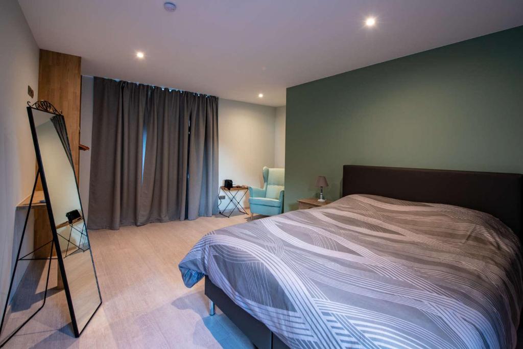 Postel nebo postele na pokoji v ubytování B&B 't Oezent