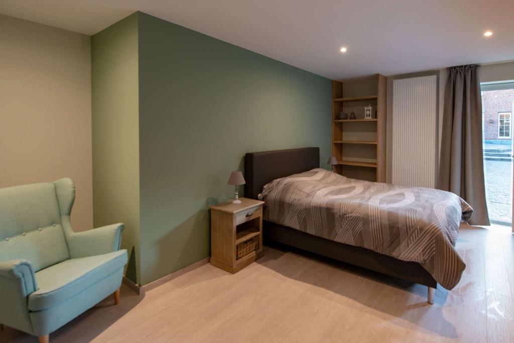 Postel nebo postele na pokoji v ubytování B&B 't Oezent
