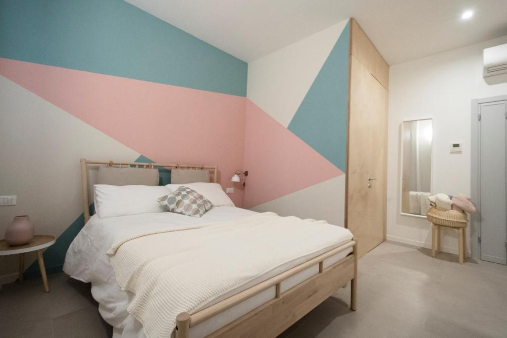 Postel nebo postele na pokoji v ubytování Mirandolina Venice Exclusive Guesthouse