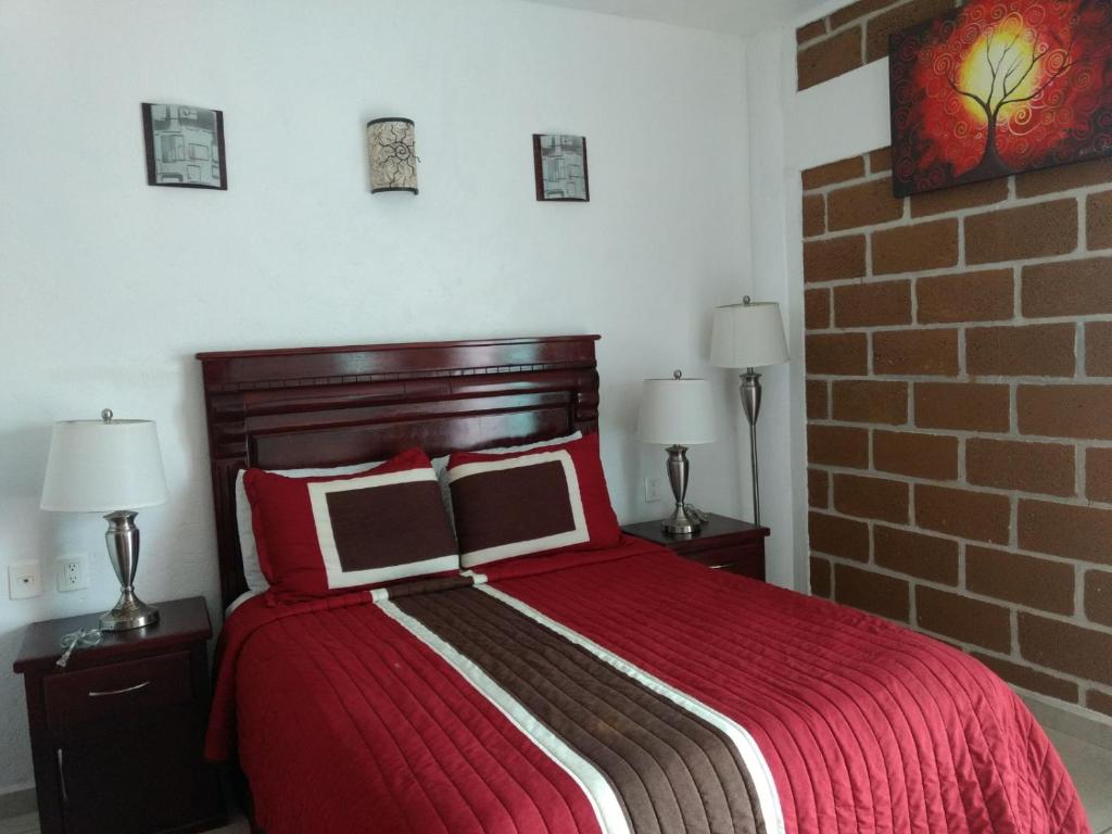 Postel nebo postele na pokoji v ubytování HOTEL JD TEPOZTLÁN