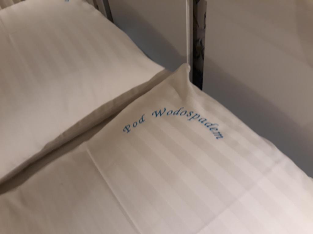 Posteľ alebo postele v izbe v ubytovaní Pod Wodospadem