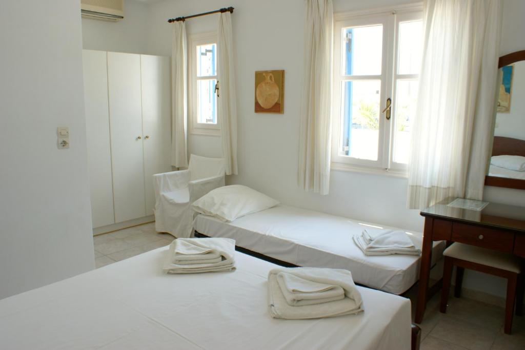Łóżko lub łóżka w pokoju w obiekcie Blue Bay Villas