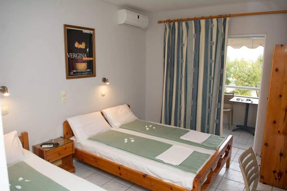 Postel nebo postele na pokoji v ubytování Giorgos Apartments Sea View