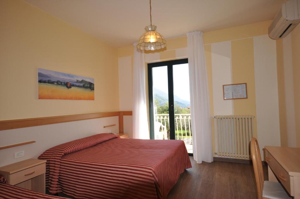 Postel nebo postele na pokoji v ubytování Hotel Panoramica