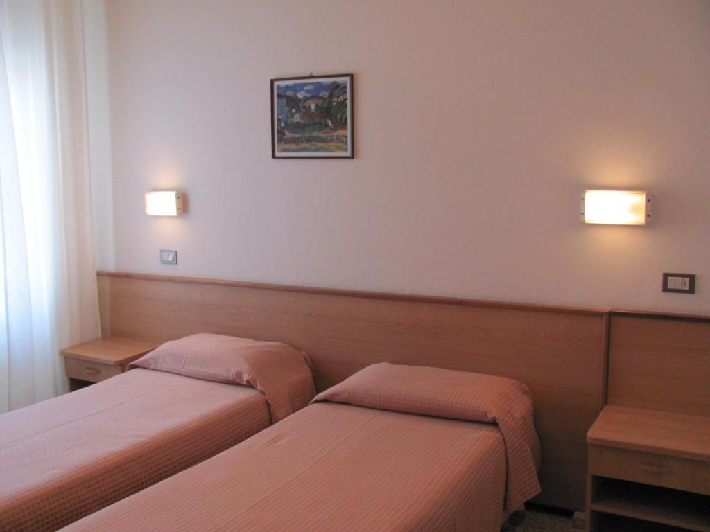 Postel nebo postele na pokoji v ubytování Albergo Moretti